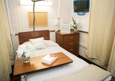 Bed with nightstand and tray