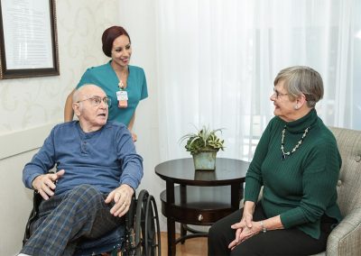 Guests conversing with an Edgewater caregiver